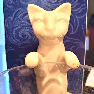 White Ceramic Cat that hangs on a plant container